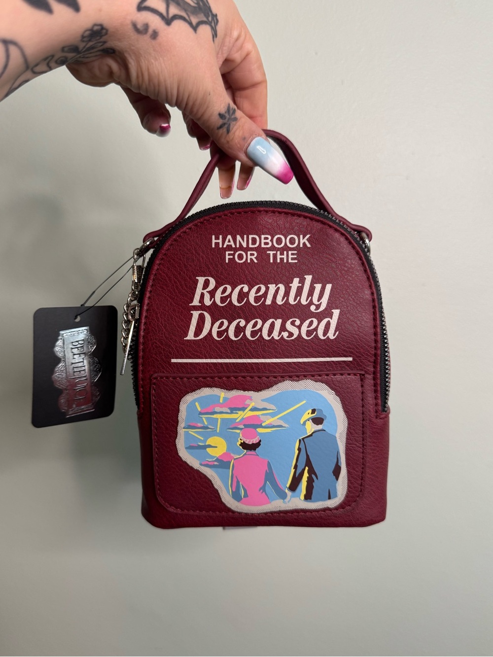 NWT Beetlejuice Handbook for the Recently Deceased Burgundy Mini Backpack Purse